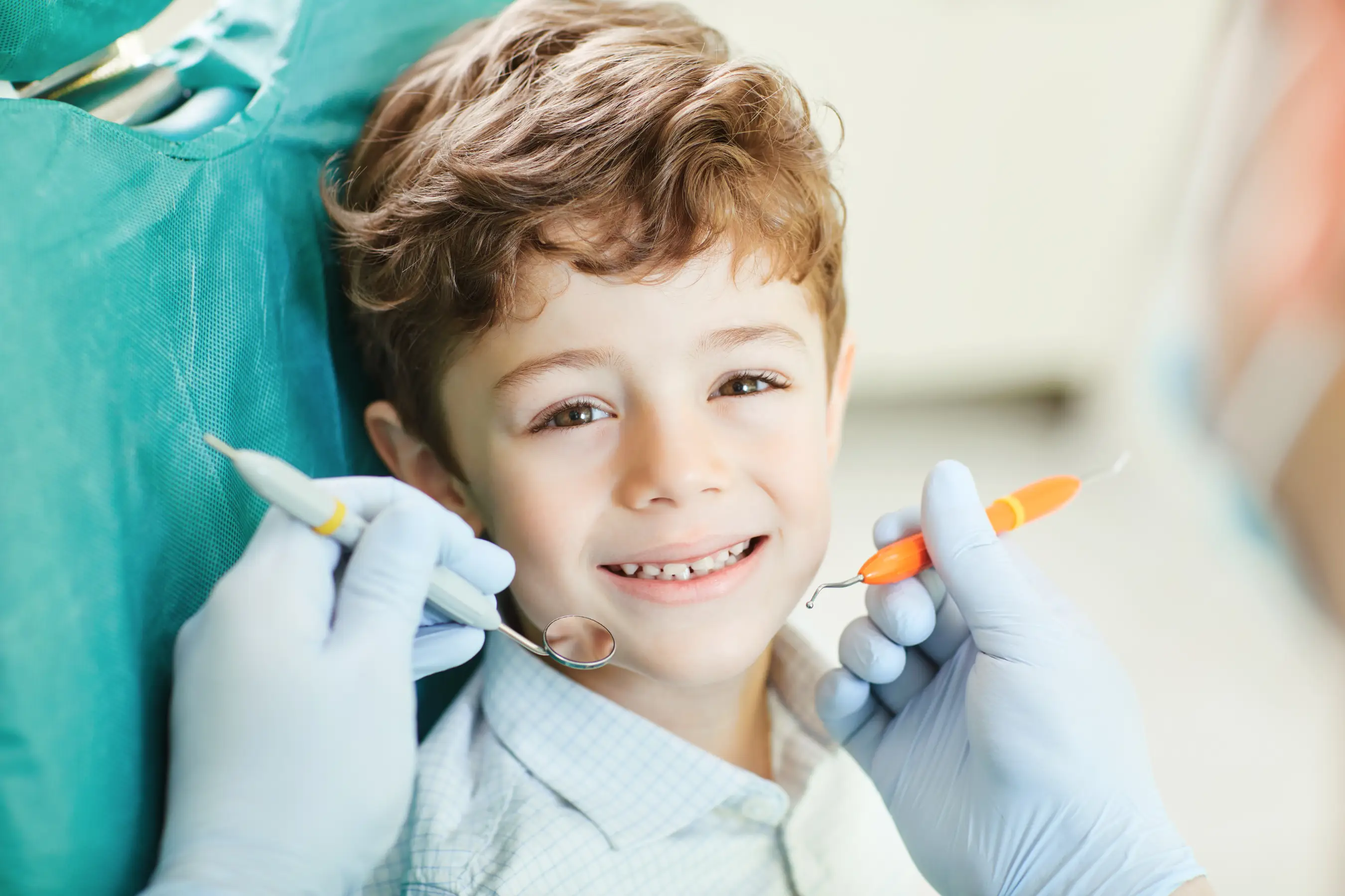 A pediatric dental crown restoring a child's tooth